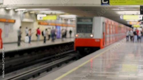 Out of focus image of the Mexico City subway leaving the station on a typical day photo