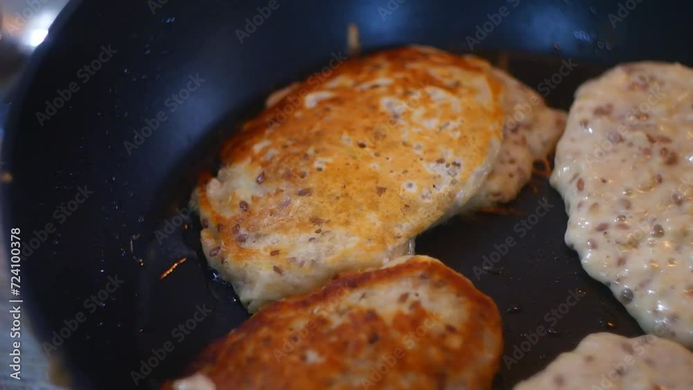 pancakes in a pan. Frying Pan On The Stove. Pancake Burned On The Pan. Mans Hand Turns The Pancake To The Other Side. He Lingers When He Sees That The Pancake Has Burned. pancakes in a pan. Frying Pan On The Stove. Pancake Burned On The Pan. Mans Hand Turns The Pancake To The Other Side. He Lingers When He Sees That The Pancake Has Burned.
