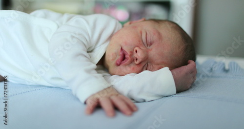 Infant newborn baby sleeping resting in bed