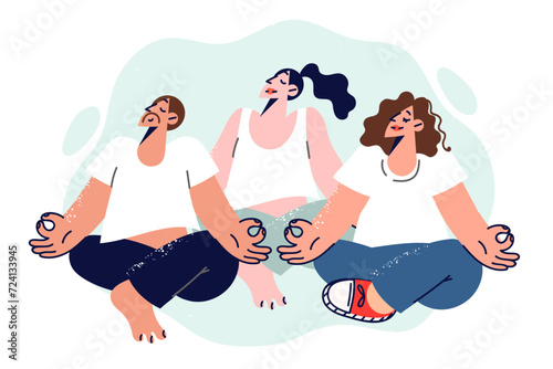 People do yoga or meditation, sitting in lotus position and practicing buddhist teachings
