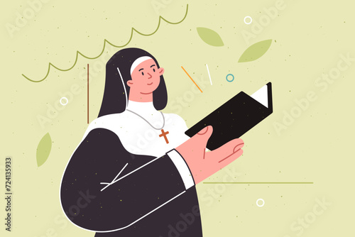 Woman priest reads religious literature or old testament standing in park, dressed in monastic robe