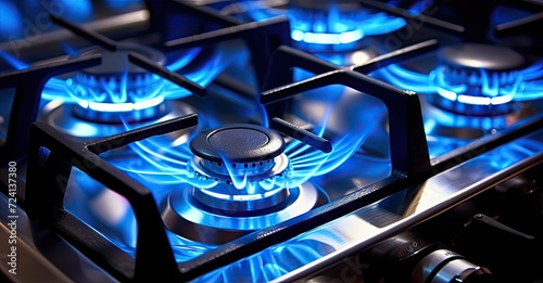 A detailed view of a gas stove showcasing the intense blue flames burning beneath the cookware.
