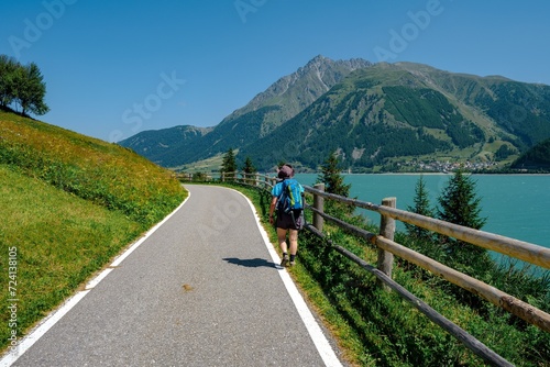 View of Lake Resia with its cycle pedestrian path in South Tyrol