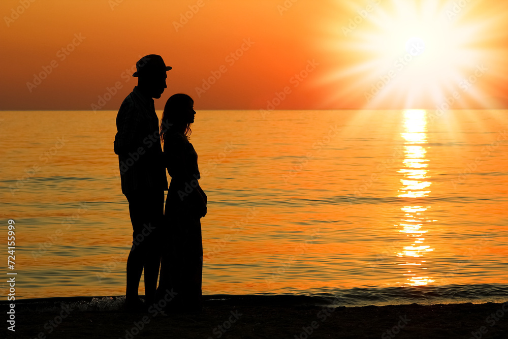 A happy couple by the sea in nature silhouette weekend travel