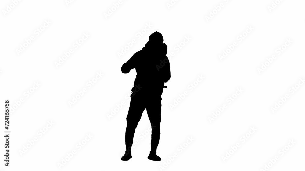 Black silhouette of a walking male tourist with a hiking backpack on his back, stops and waves his hand in greeting. A man hiker on white isolated background.