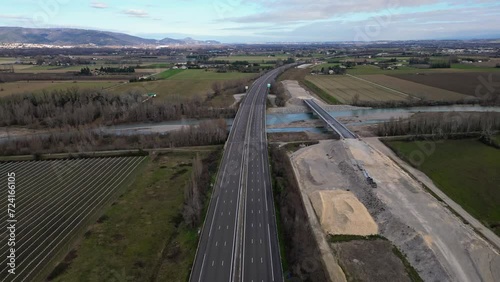 Loriol sur Drome, France - January 27, 2024: Empty A7 Sunny Motorway in France. Farmers' Protest, Tires, Tractors, Agricultural Machines on the Highway, completely blocking road traffic. photo