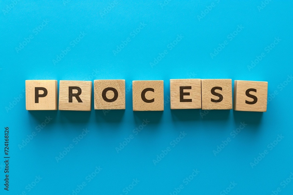 Captivating Display of the Word 'PROCESS' Using Wooden Blocks Captivating Display of the Word 'PROCESS' Using Wooden Blocks