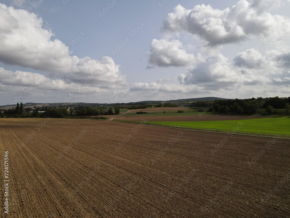 Aerial view of a plowed agriculture field with soil