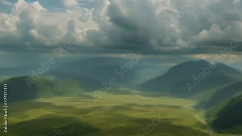 Aerial View of a Cloudy Sky Over a Valley and Mountains. Generative AI.
