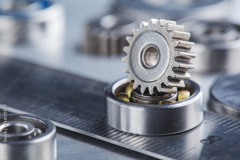 metal gears and bearings. Background with part of the mechanism. metal gears and bearings. Background with part of the mechanism.