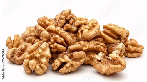 a pile of walnuts on a white surface