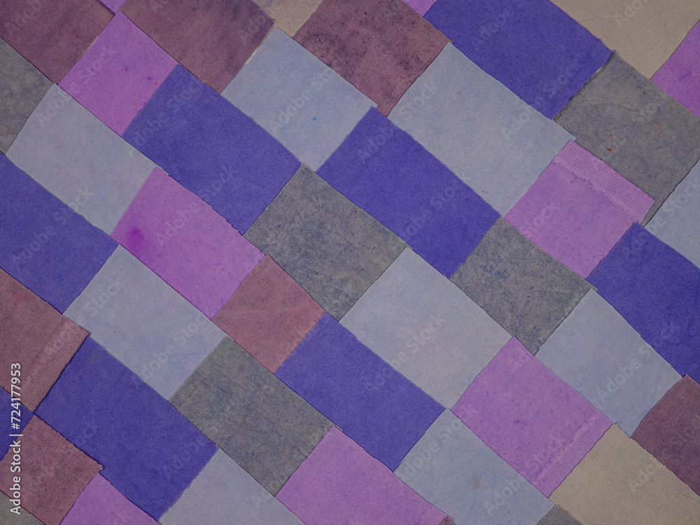Fototapeta premium Handmade background in patchwork style with cotton fabric elements in purple tones 