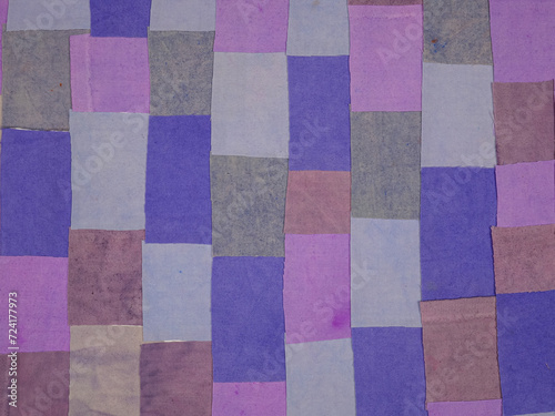 Handmade background in patchwork style with cotton fabric elements in purple tones © botevvs