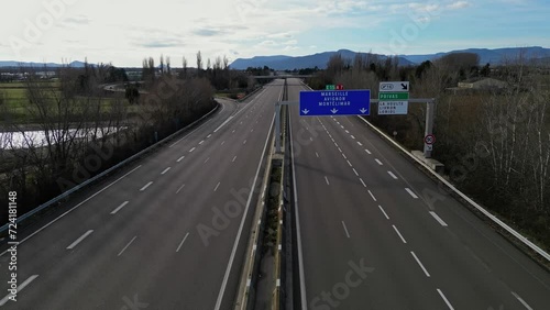 Loriol sur Drome, France - January 27, 2024: Empty A7 Sunny Motorway in France. Farmers' Protest, Tires, Tractors, Agricultural Machines on the Highway, completely blocking road traffic. photo