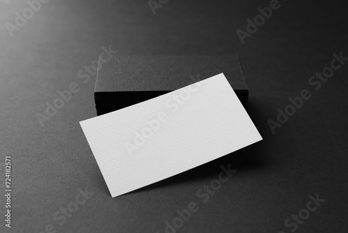 Blank business cards on black background. Mockup for design © New Africa