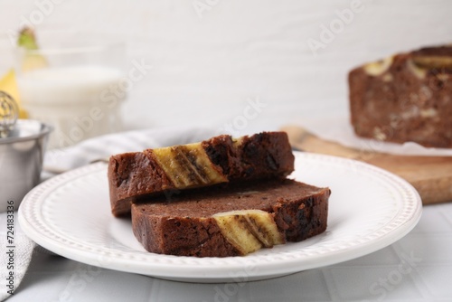 Slices of delicious banana bread served on table, closeup