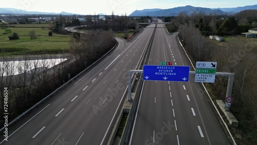 Loriol sur Drome, France - January 27, 2024: Empty A7 Sunny Motorway in France. Farmers' Protest, Tires, Tractors, Agricultural Machines on the Highway, completely blocking road traffic. photo