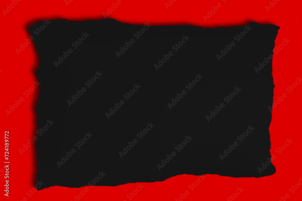 Black construction paper torn in the middle with a red background on the outside Black construction paper torn in the middle with a red background on the outside