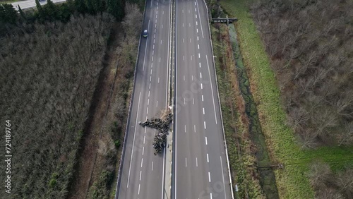 Loriol sur Drome, France - January 27, 2024: Empty A7 Sunny Motorway in France. Farmers' Protest, Tires, Tractors, Agricultural Machines on the Highway, completely blocking road traffic. photo