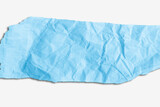 Scrap of crumpled blue paper on light  background