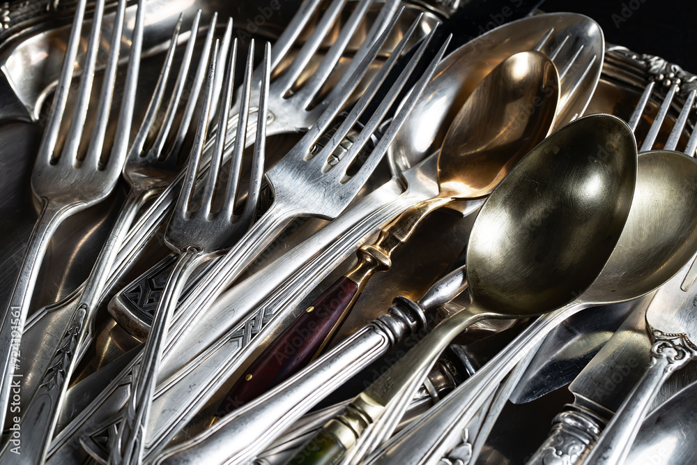 custom made wallpaper toronto digitalAntique silver cutlery on a dark background in a composition on a table.