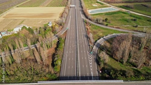 Loriol sur Drome, France - January 27, 2024: Empty A7 Sunny Motorway in France. Farmers' Protest, Tires, Tractors, Agricultural Machines on the Highway, completely blocking road traffic. photo