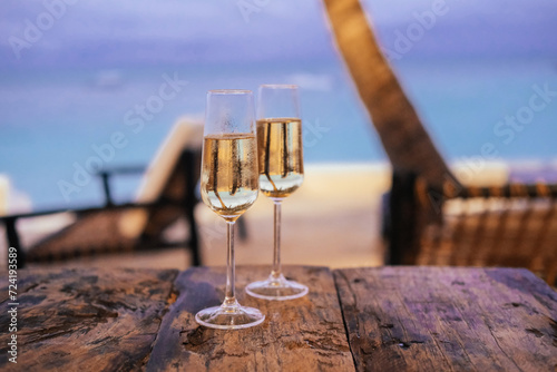 Wallpaper Mural Two glasses of champagne in an outdoor cafe on an island, palm trees, sea, sunset  Torontodigital.ca