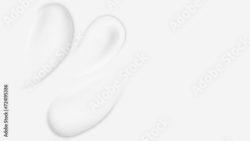 Smears of white cream on light background