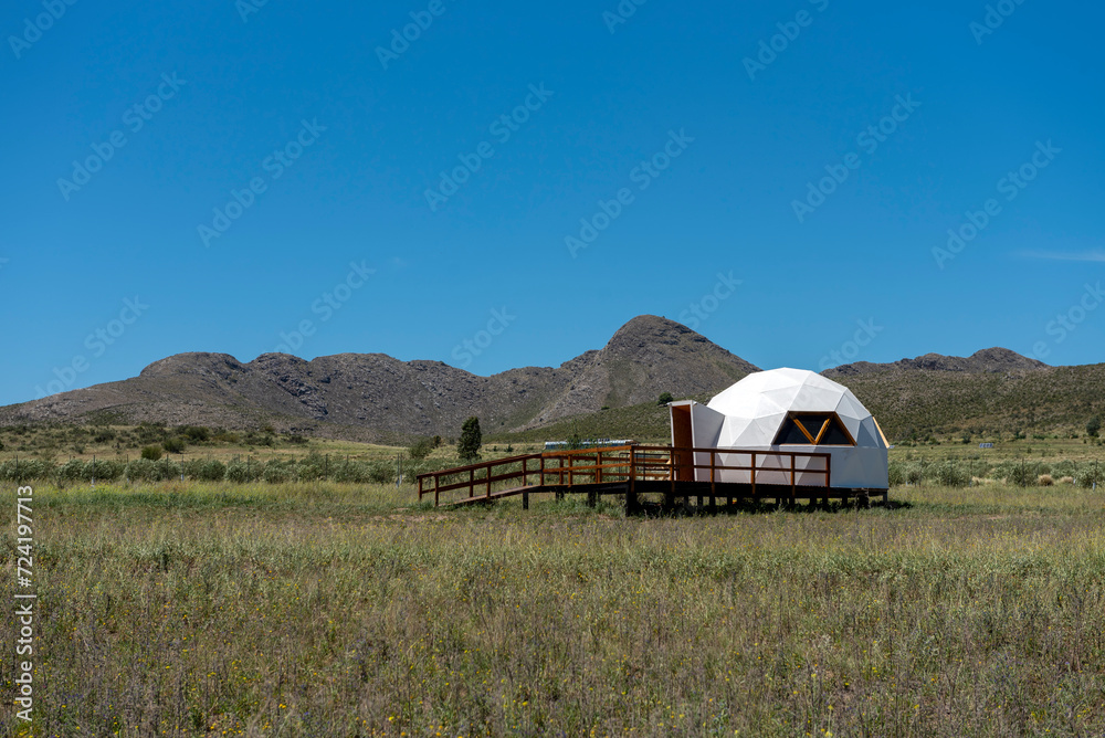 modern ecological house in the middle of the countryside and the mountains self-sustaining domes or individual geodesic domes