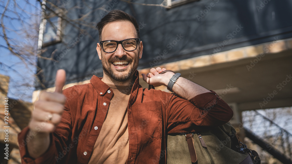 Portrait of one man happy caucasian male with travel bag at his house Portrait of one man happy caucasian male with travel bag at his house