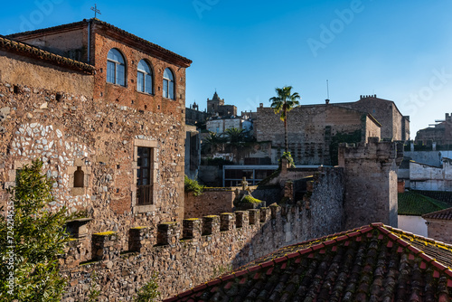 Medieval constructions next to the wall of the medieval city of Caceres, Spain. photo