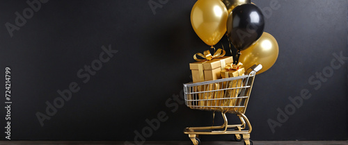 Black Friday Gift Box and Golden Balloons a shopping cart on a Stylish Black Wall - Ideal for Black Friday and Celebration Cards with Balloons, Gift Boxes, and Ample Copy Space