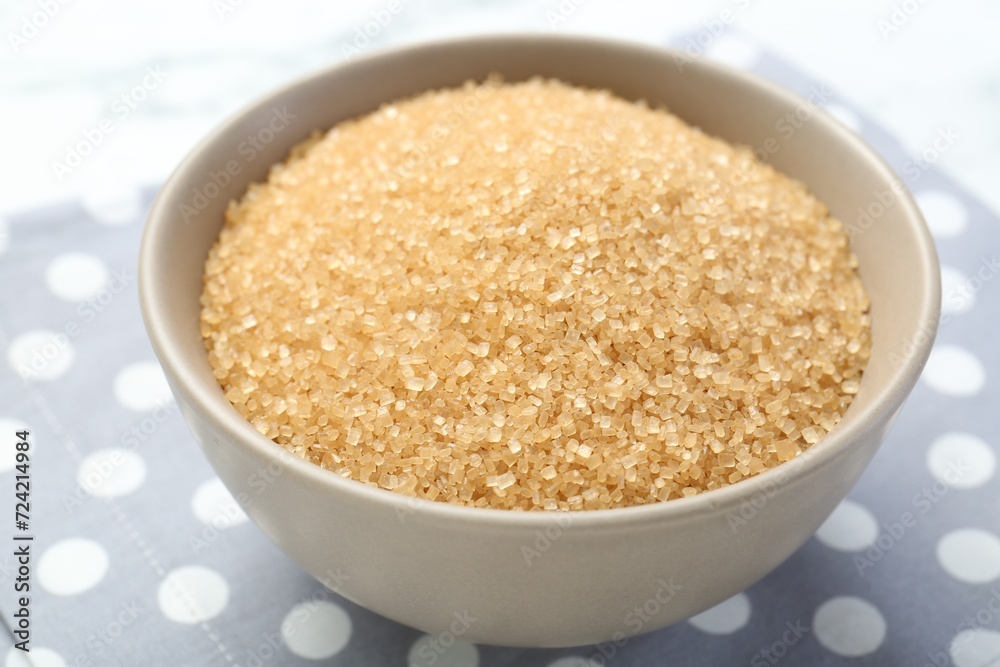 Brown sugar in bowl on table, closeup Brown sugar in bowl on table, closeup