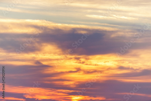 evening sky with blue, white and red clouds