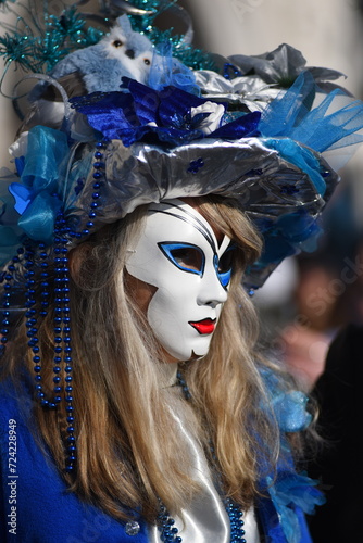Fototapeta Naklejka Na Ścianę i Meble -  Masked person during the first day of the Venice carnival