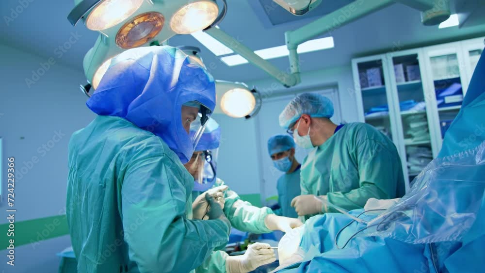 Group of surgeons begin the operation on trauma. Chief surgeon drawing ...