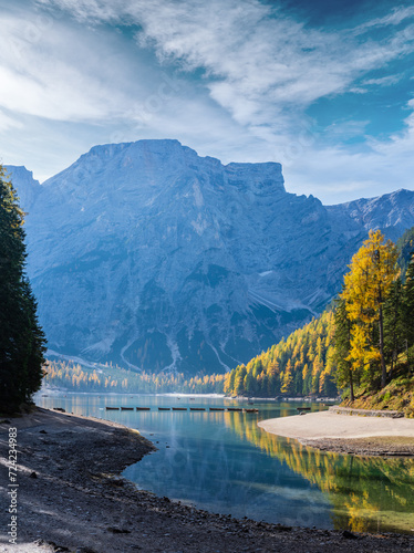 Autumn peaceful alpine lake Braies or Pragser Wildsee. Dolomites Alps, Italy, Europe. People unrecognizuble.