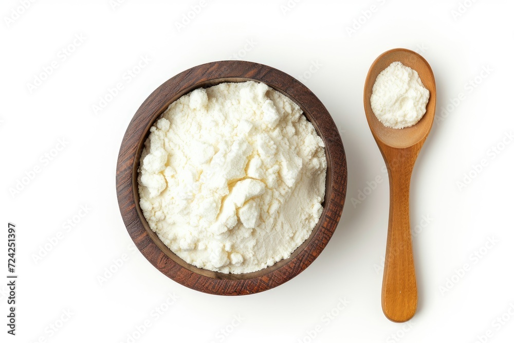 Bird s eye view of spoon and bowl of corn starch on white background Bird s eye view of spoon and bowl of corn starch on white background