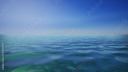 A serene landscape with a vast blue sky reflecting on a peaceful body of water