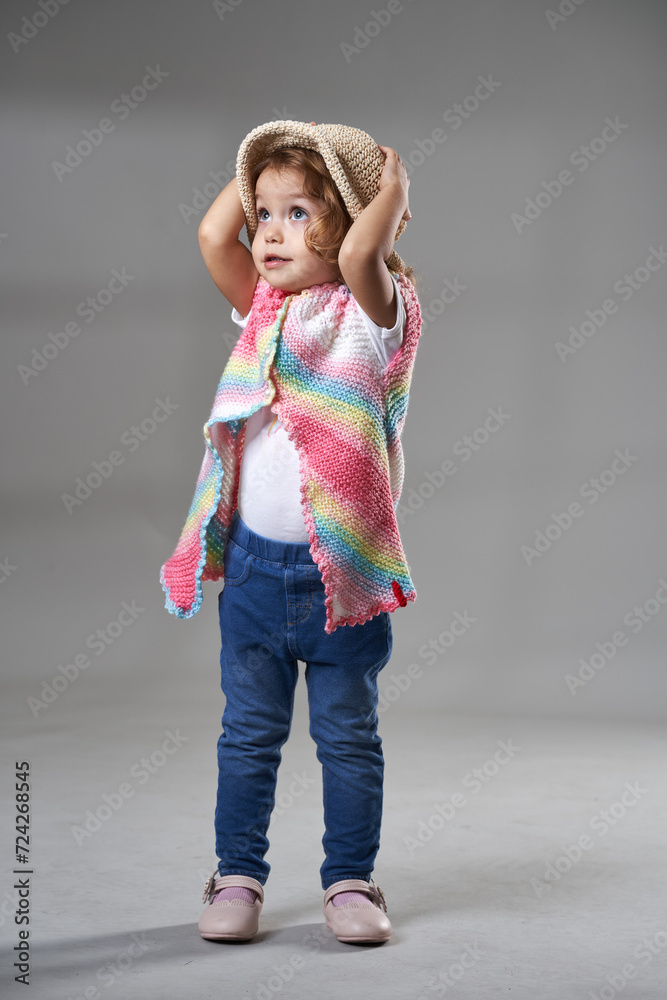 Little girl on gray background