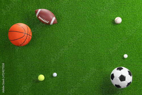 Many different sports balls on green grass  flat lay. Space for text