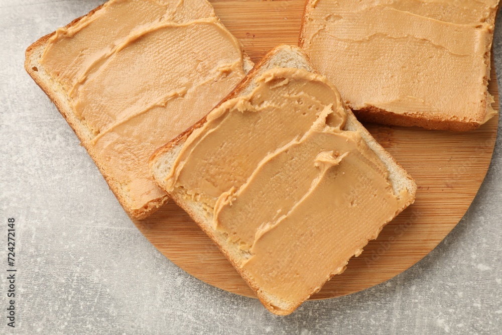 Tasty peanut butter sandwiches on gray table, top view Tasty peanut butter sandwiches on gray table, top view