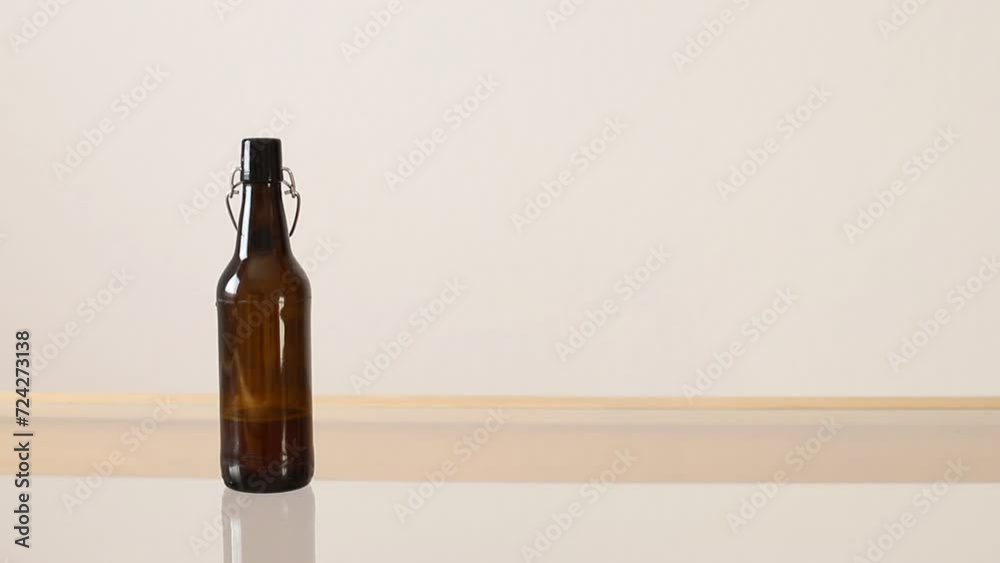 Female hand takes glass with foaming fresh beer from table. Female hand takes glass with foaming fresh beer from table.