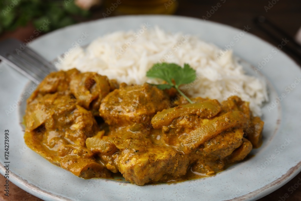 Delicious chicken curry with rice on table, closeup Delicious chicken curry with rice on table, closeup