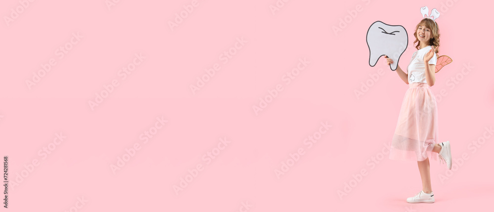 Tooth fairy with paper tooth on pink background with space for text Tooth fairy with paper tooth on pink background with space for text