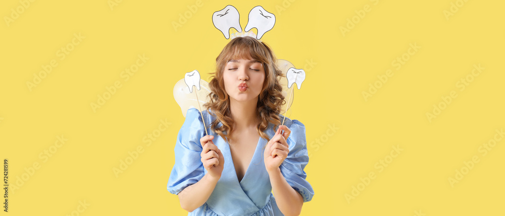 Grimacing tooth fairy with paper teeth on yellow background