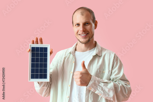 Young man with portable sol...
