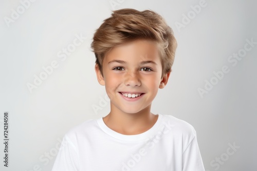 portrait of a cute smiling little boy in a white t-shirt