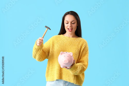 Young woman with hammer and...