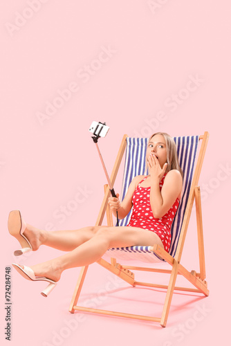 Beautiful young woman takin...